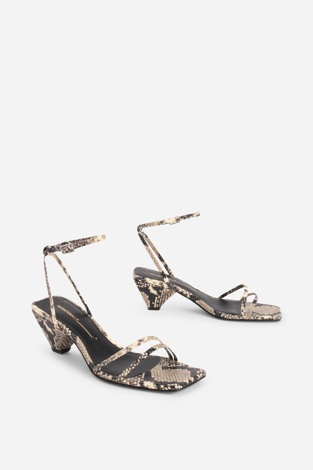 INTENTIONALLY __________. Pretty Please Snake Embossed Heel Sandal - Black White