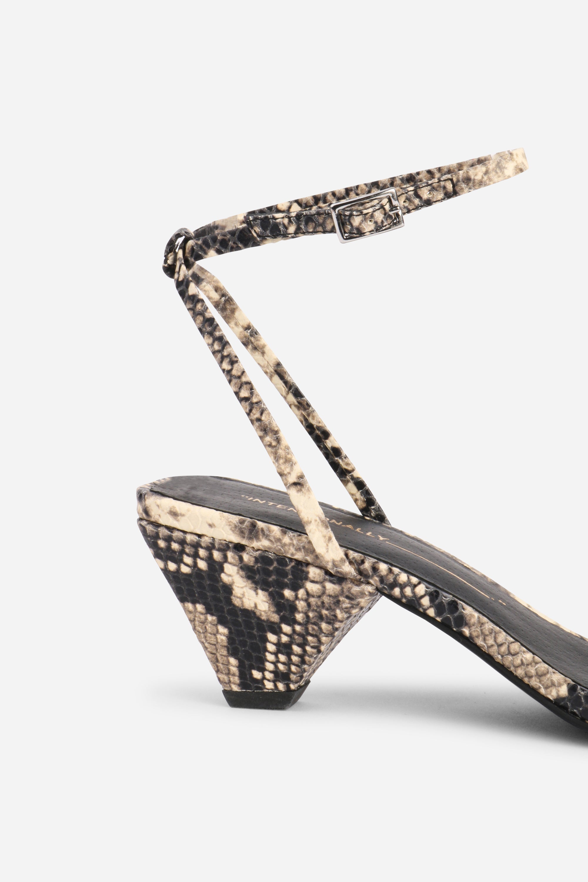 INTENTIONALLY __________. Pretty Please Snake Embossed Heel Sandal - Black White
