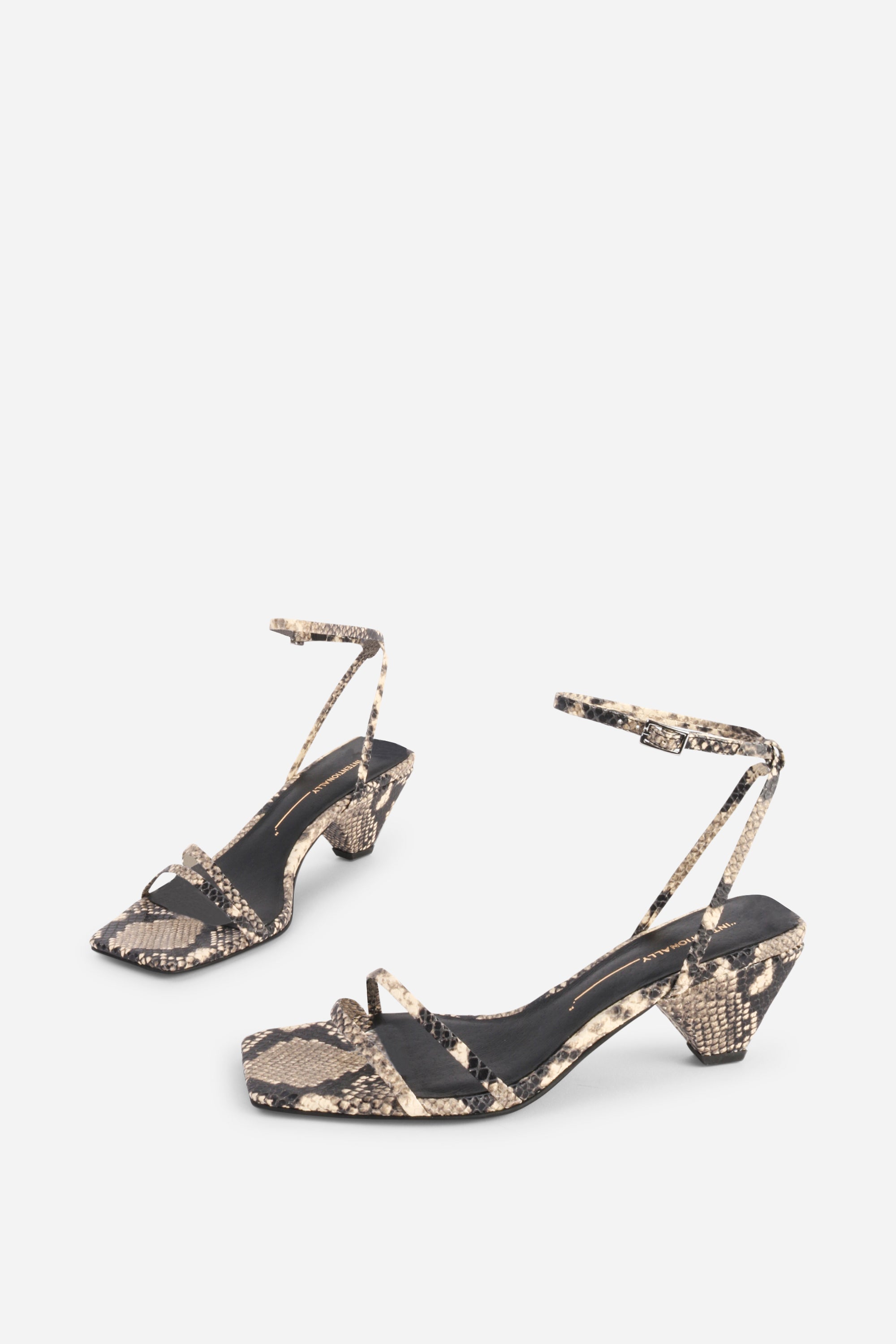 INTENTIONALLY __________. Pretty Please Snake Embossed Heel Sandal - Black White
