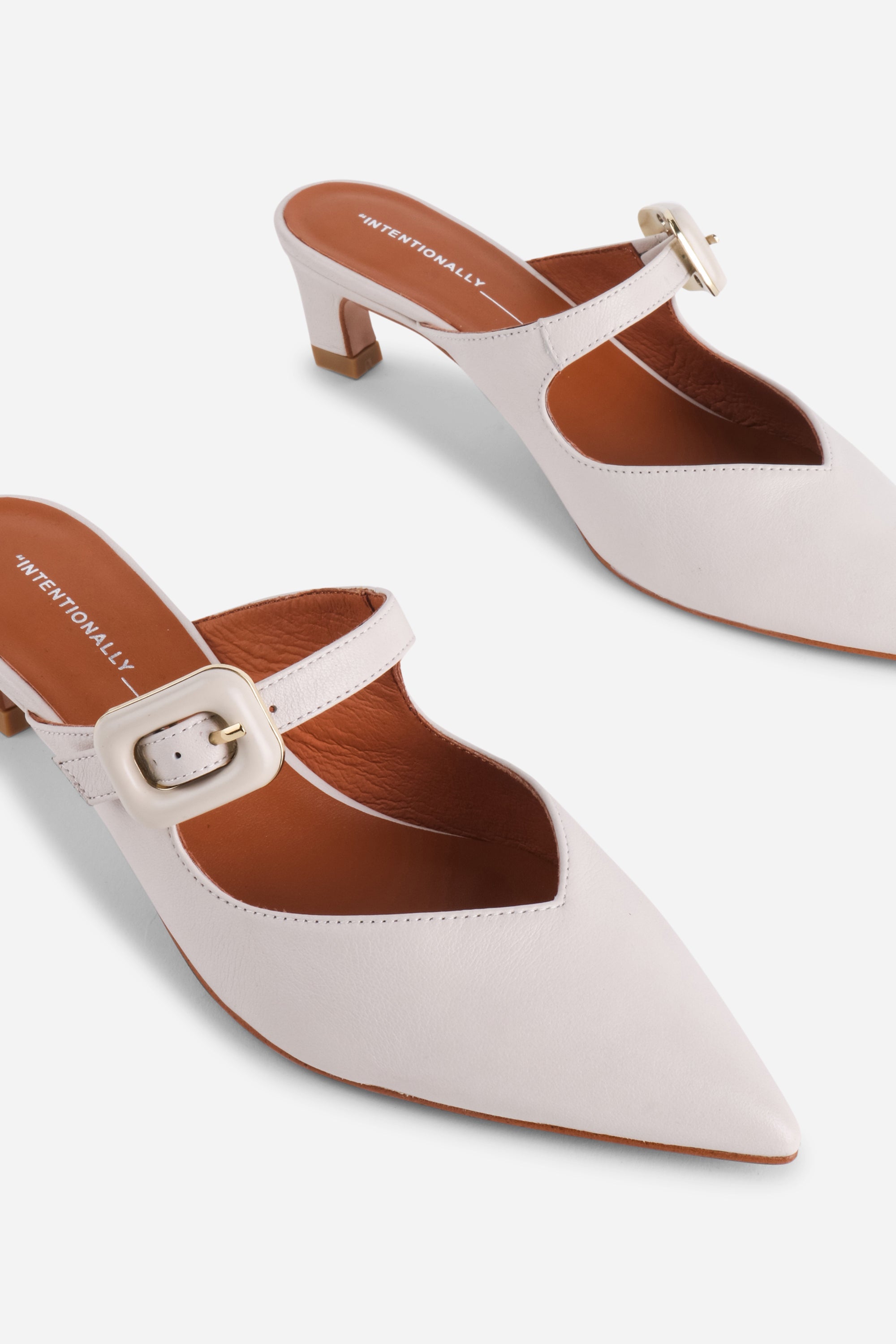 "INTENTIONALLY __________." Promo Mule Heel - Cream