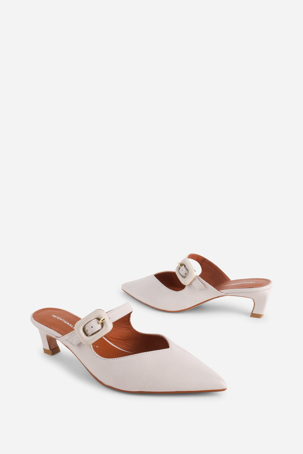 "INTENTIONALLY __________." Promo Mule Heel - Cream