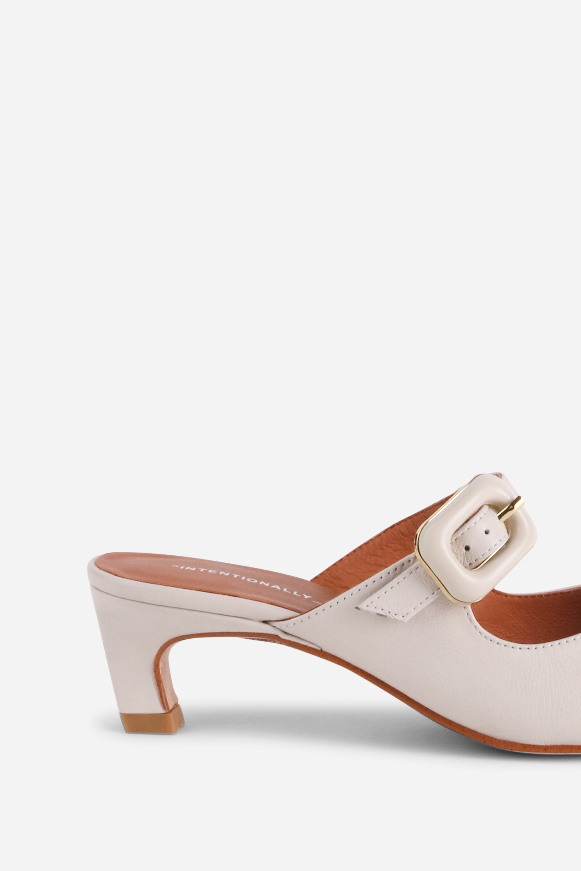 "INTENTIONALLY __________." Promo Mule Heel - Cream