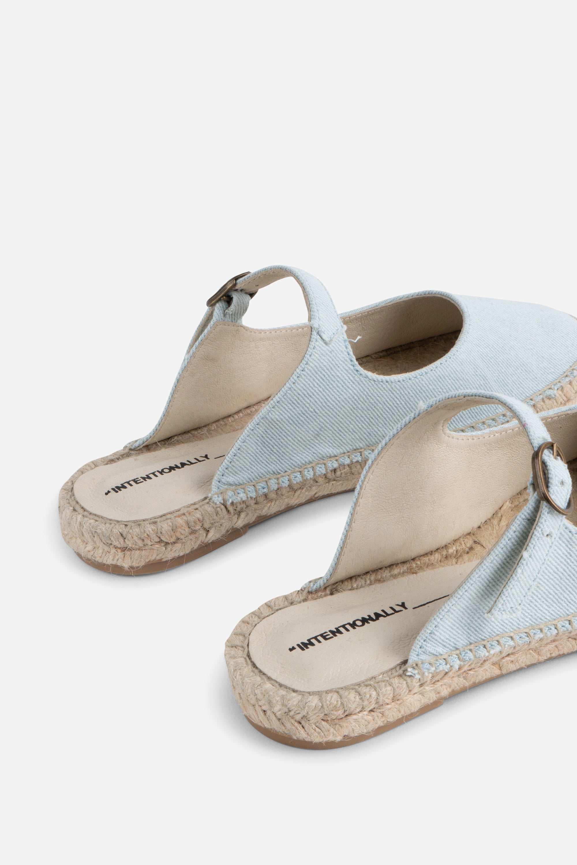 "INTENTIONALLY __________." Reports Denim Slip On Espadrille - Light Blue