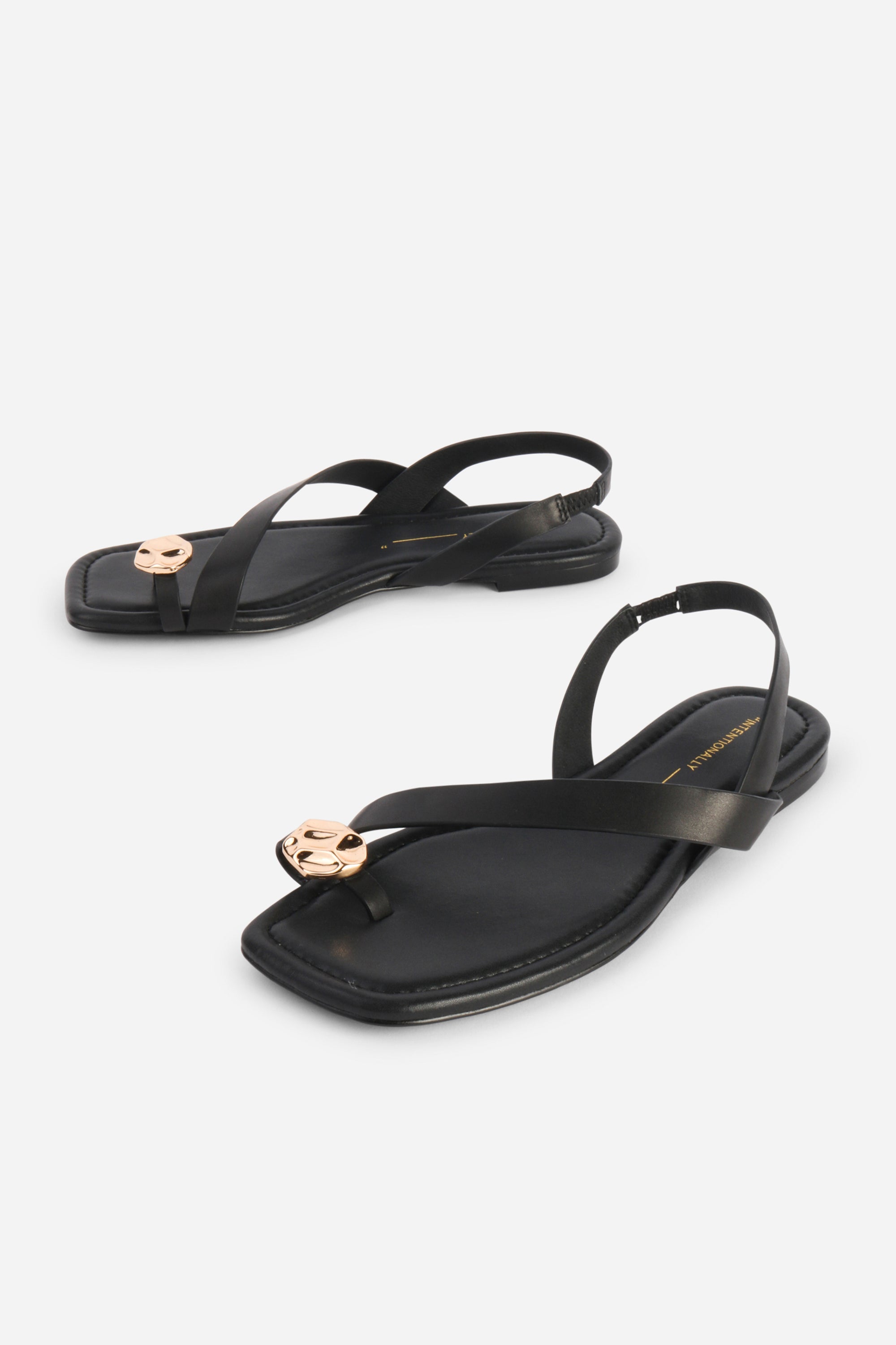 INTENTIONALLY __________. Roro Toe Ring Slingback Flat Sandal