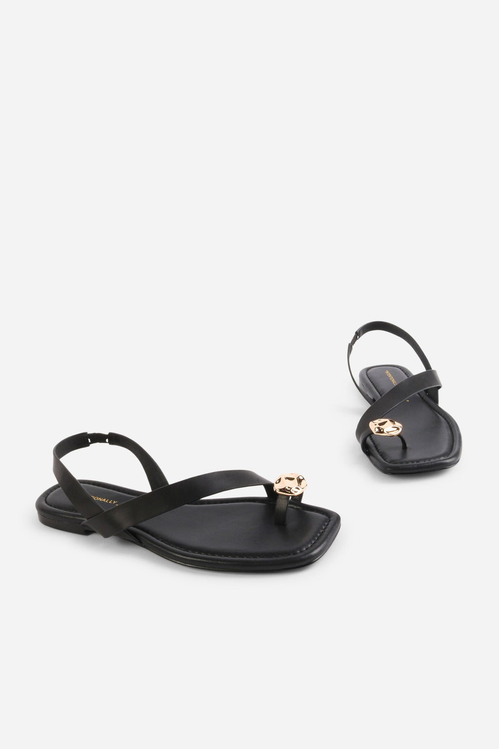 INTENTIONALLY __________. Roro Toe Ring Slingback Flat Sandal