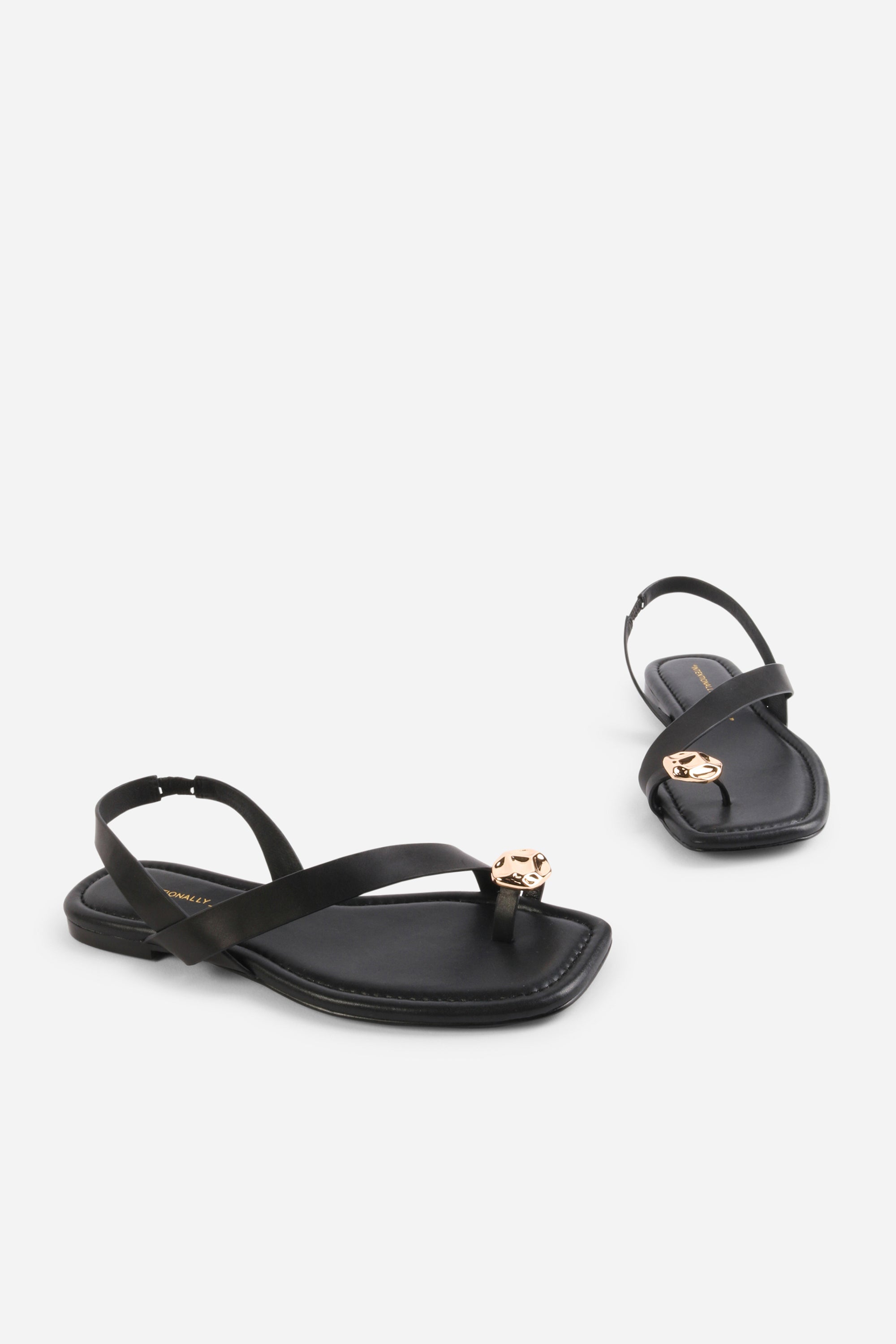 INTENTIONALLY __________. Roro Toe Ring Slingback Flat Sandal