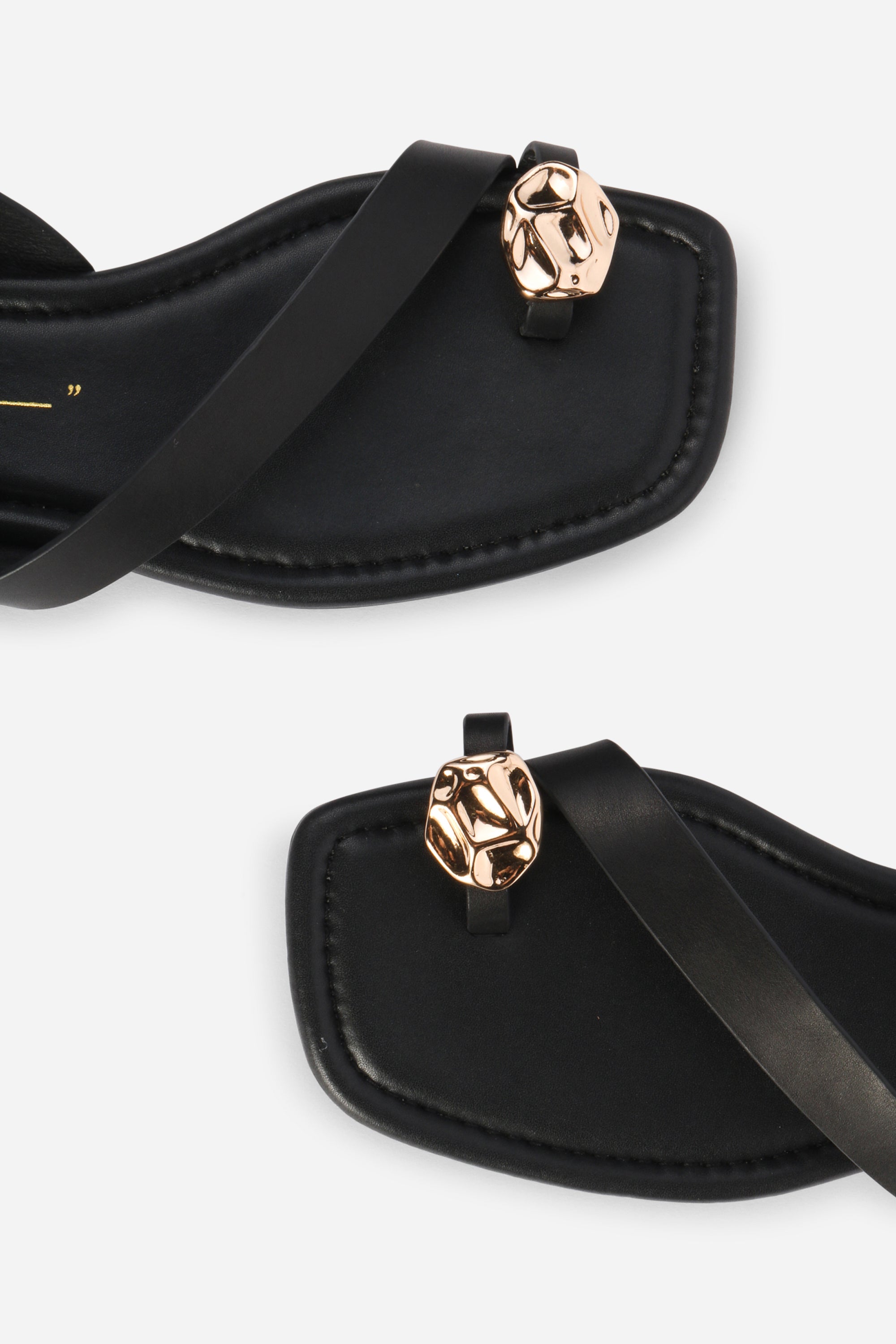 INTENTIONALLY __________. Roro Toe Ring Slingback Flat Sandal