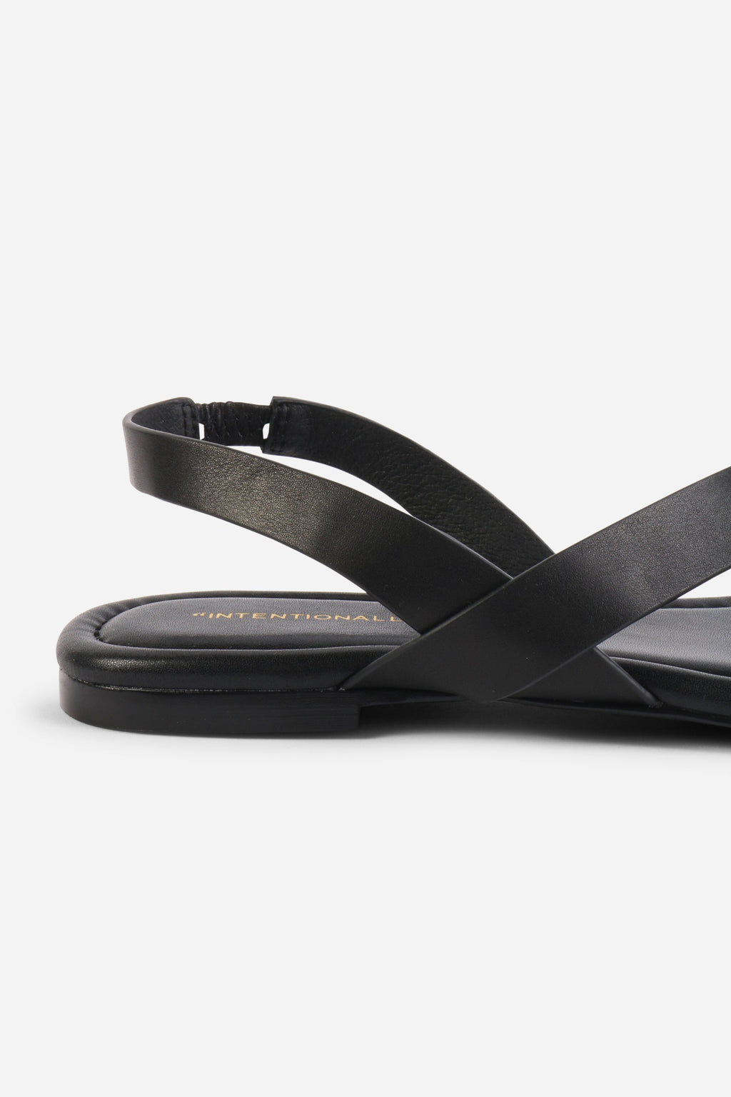 INTENTIONALLY __________. Roro Toe Ring Slingback Flat Sandal