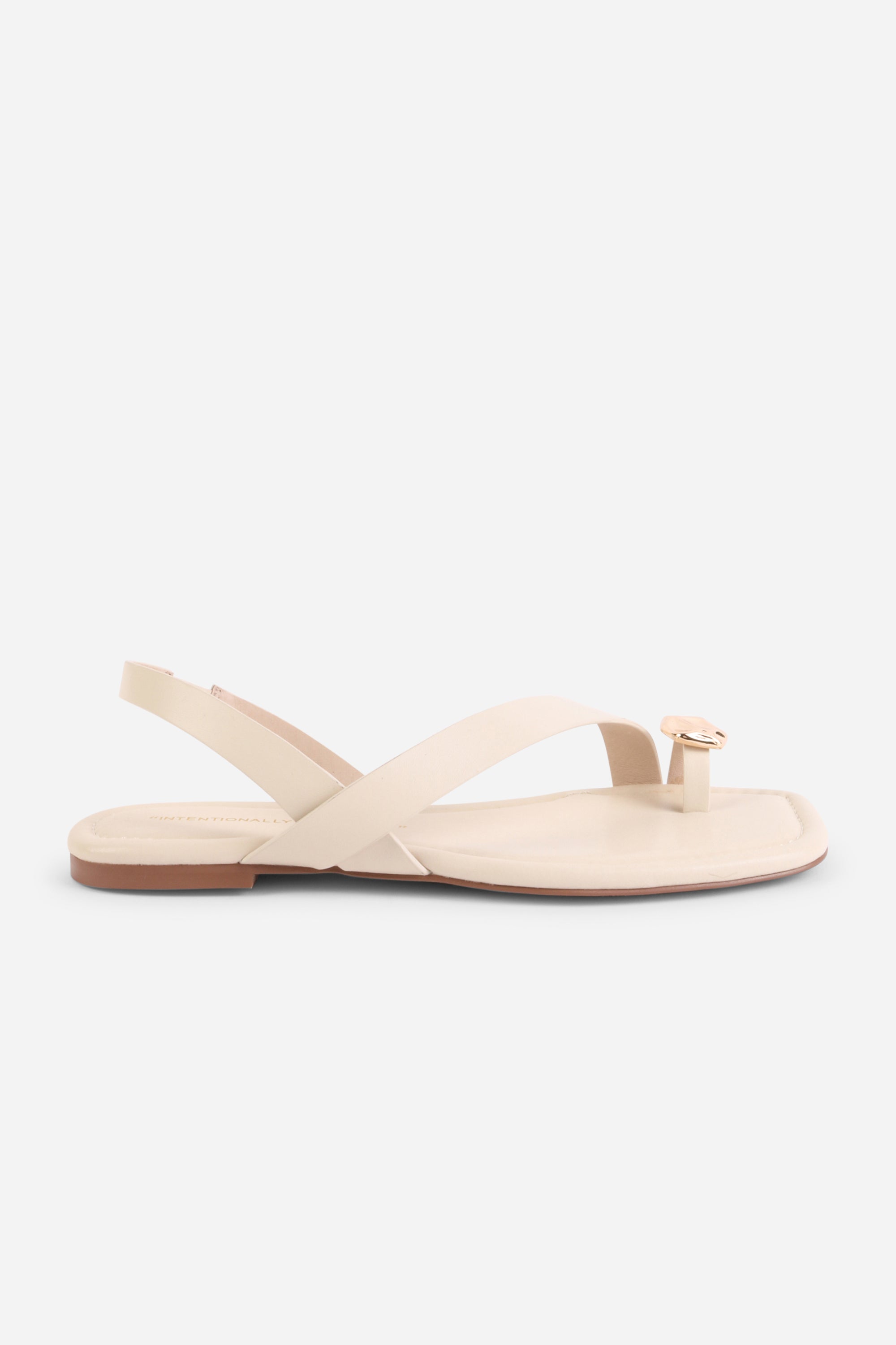 INTENTIONALLY __________. Roro Toe Ring Slingback Flat Sandal