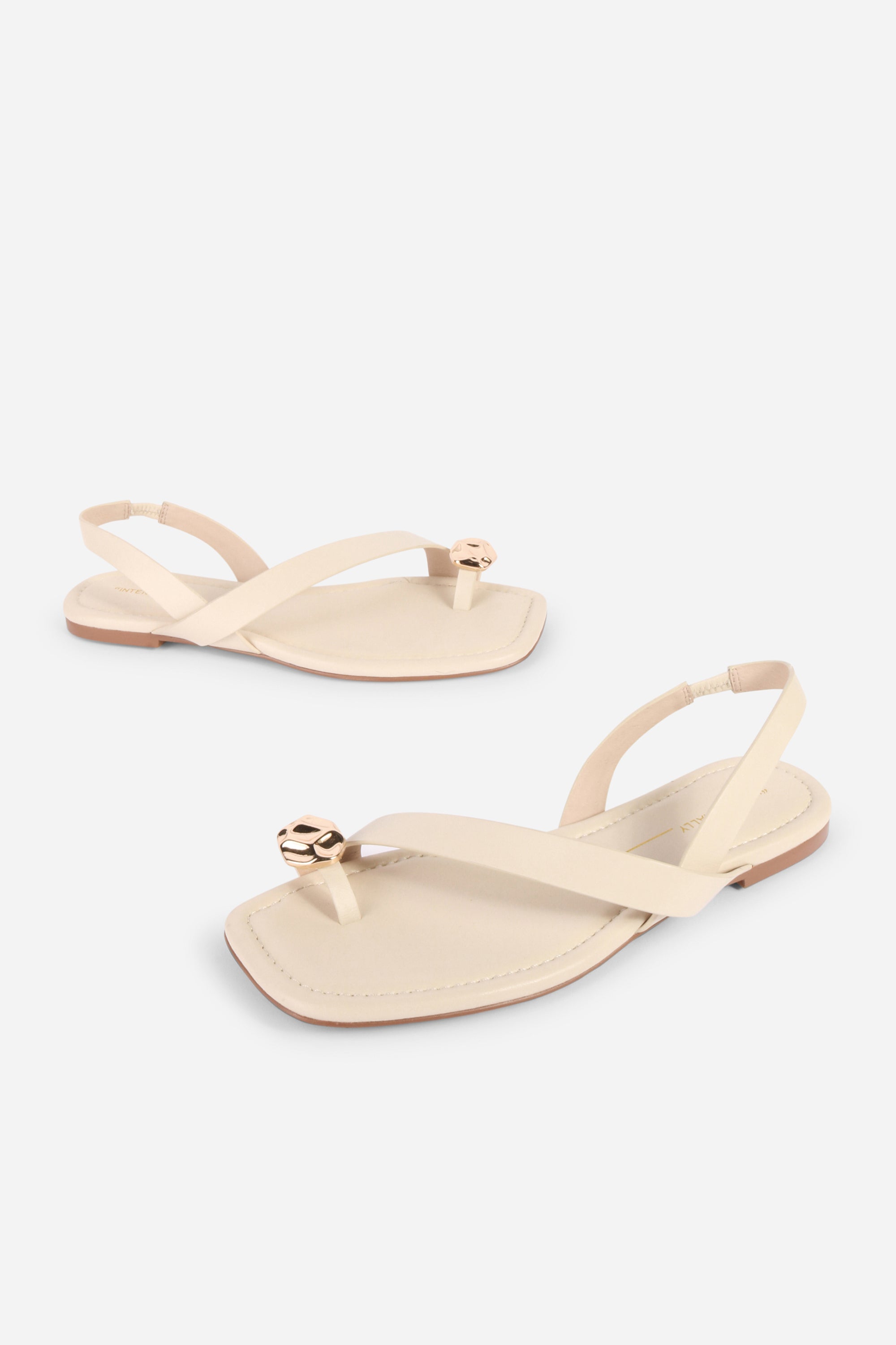 INTENTIONALLY __________. Roro Toe Ring Slingback Flat Sandal