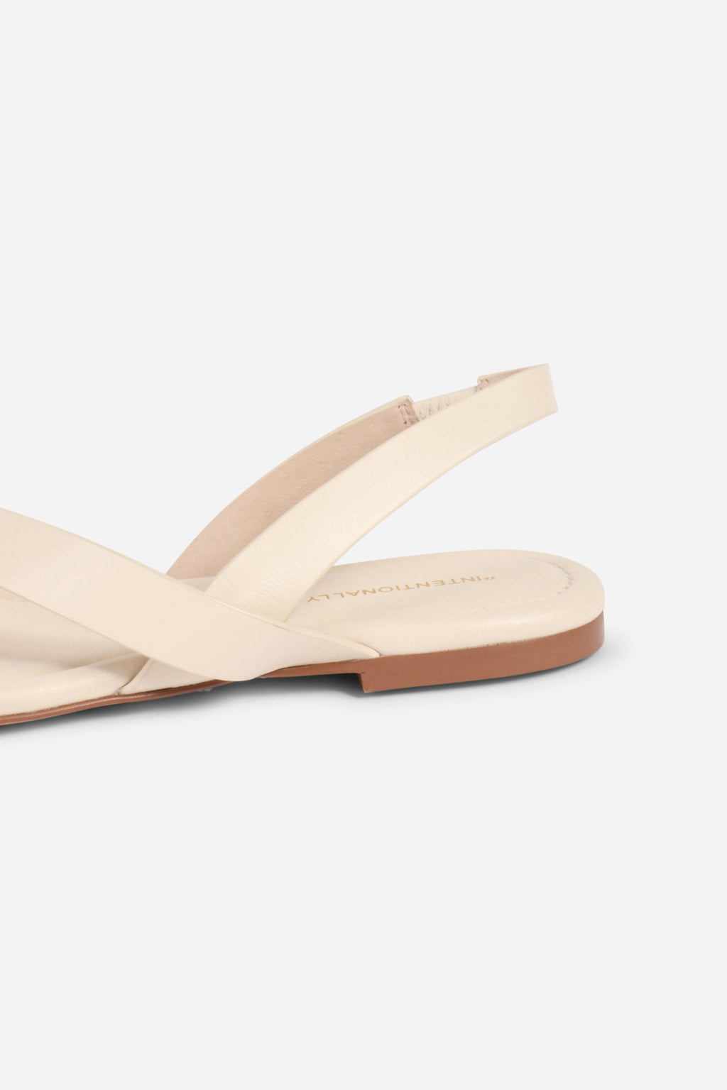 INTENTIONALLY __________. Roro Toe Ring Slingback Flat Sandal