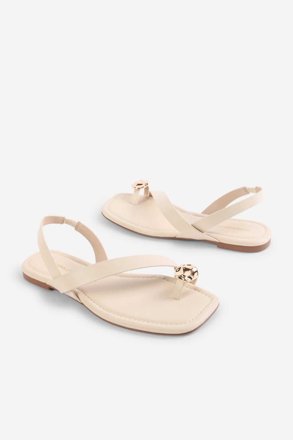 INTENTIONALLY __________. Roro Toe Ring Slingback Flat Sandal