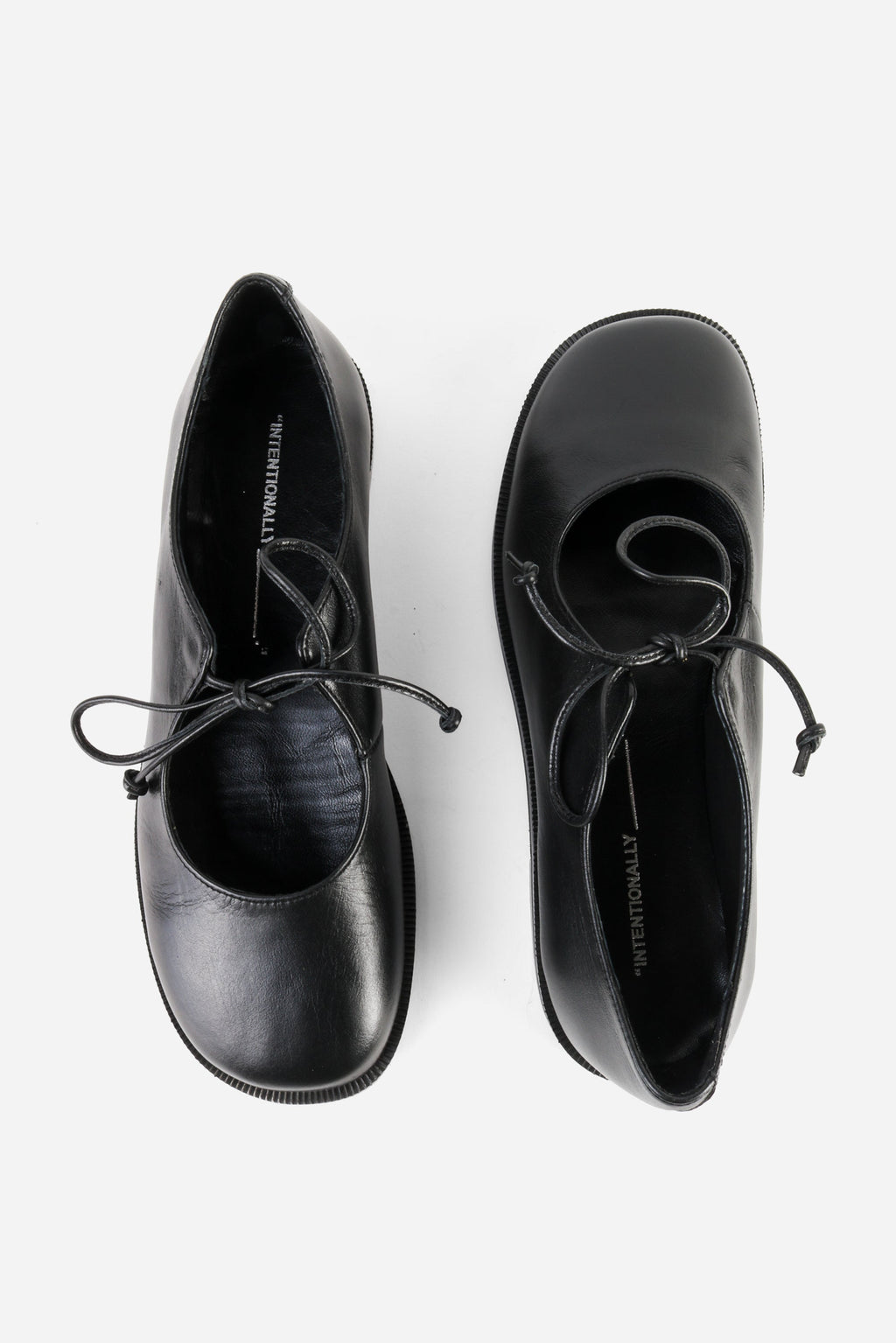 "INTENTIONALLY __________." Spaces Lace-Up Mary Jane Flat - Black