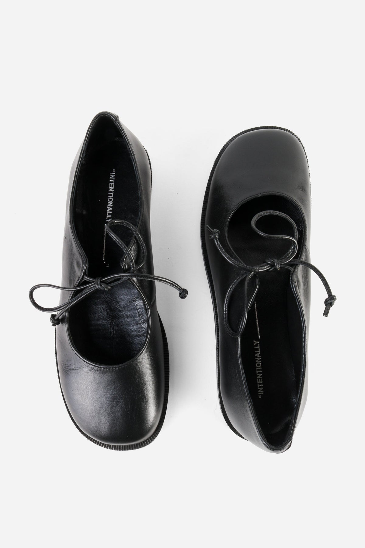 "INTENTIONALLY __________." Spaces Lace-Up Mary Jane Flat - Black