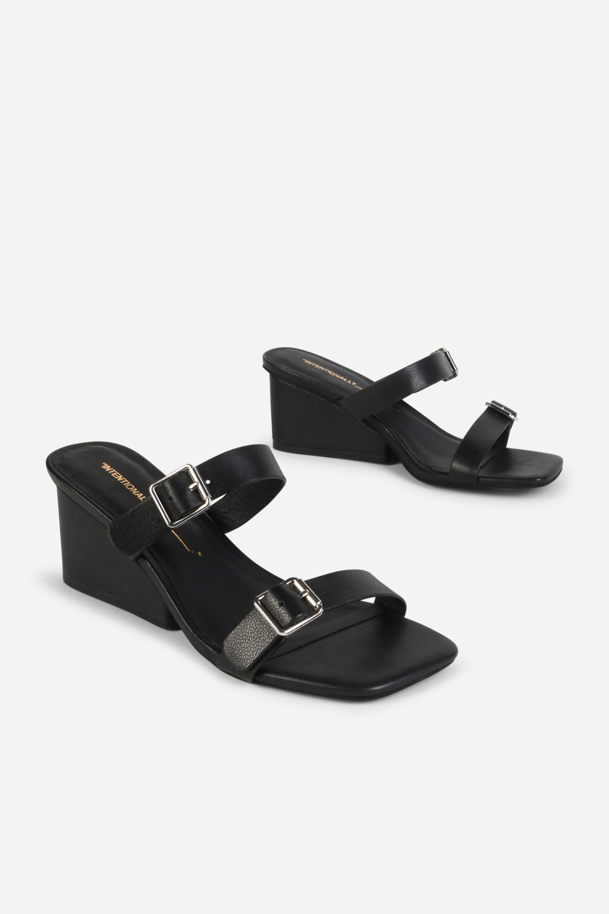 INTENTIONALLY __________. Surrender Leather Wedge Heel Sandals