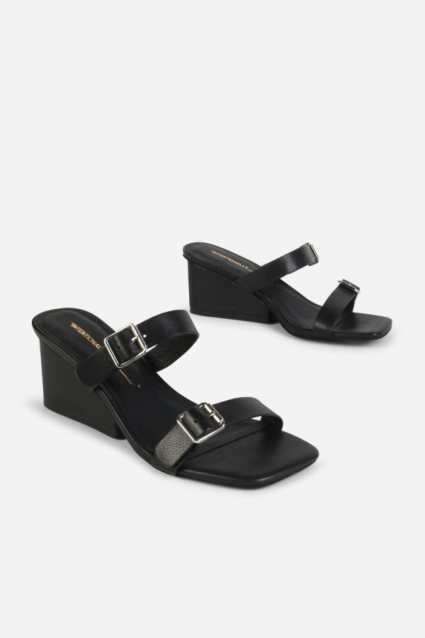 INTENTIONALLY __________. Surrender Leather Wedge Heel Sandals