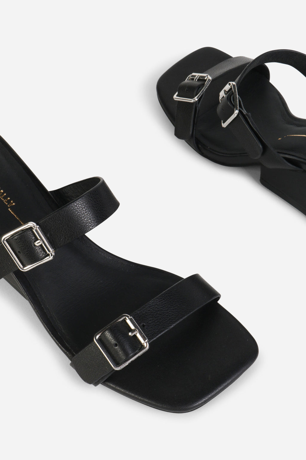 INTENTIONALLY __________. Surrender Leather Wedge Heel Sandals