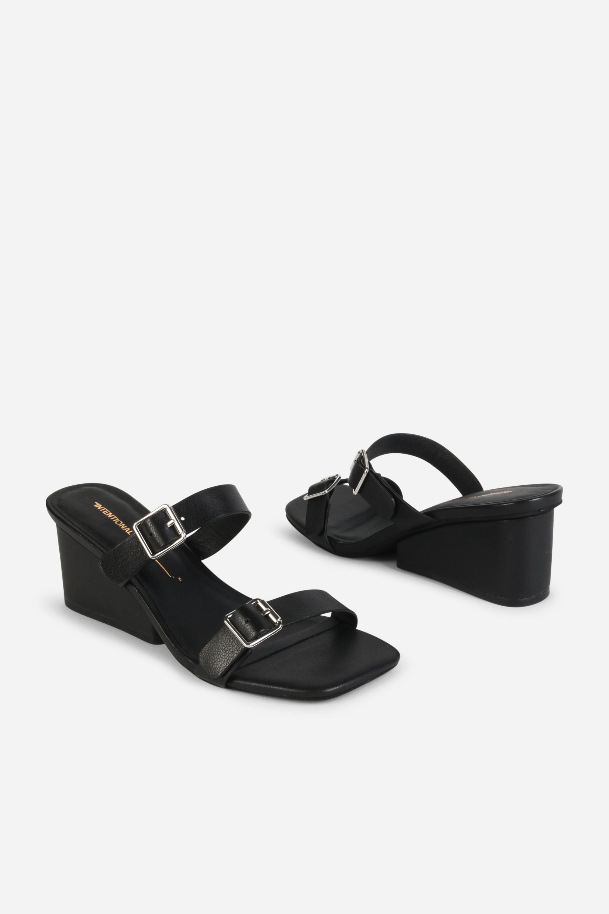 INTENTIONALLY __________. Surrender Leather Wedge Heel Sandals