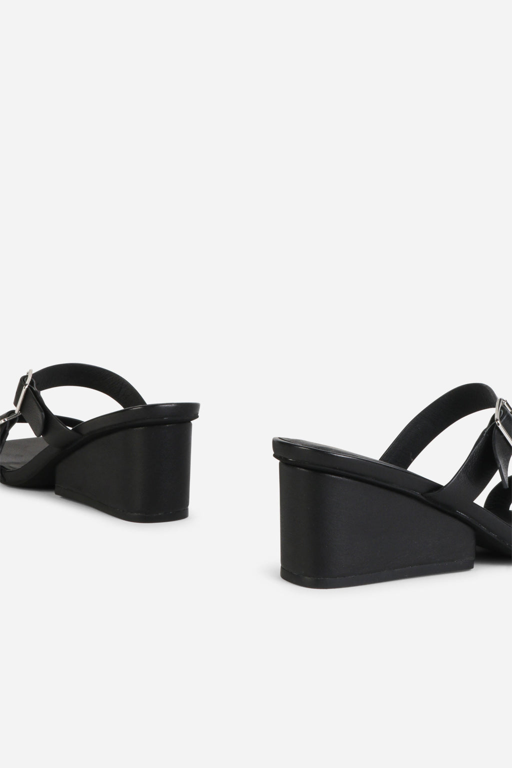 INTENTIONALLY __________. Surrender Leather Wedge Heel Sandals