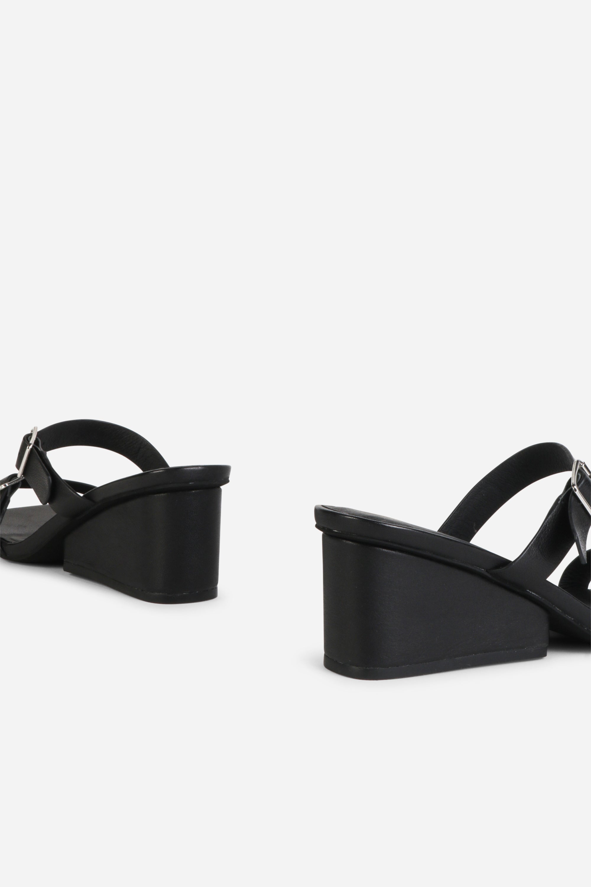 INTENTIONALLY __________. Surrender Leather Wedge Heel Sandals