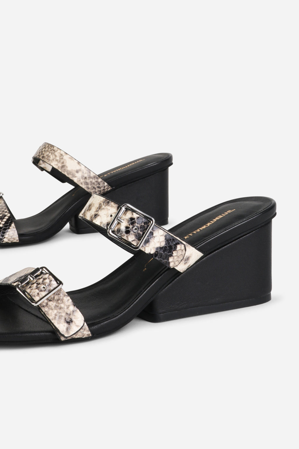 INTENTIONALLY __________. Surrender Snake Embossed Wedge Heel Sandal - Black/White