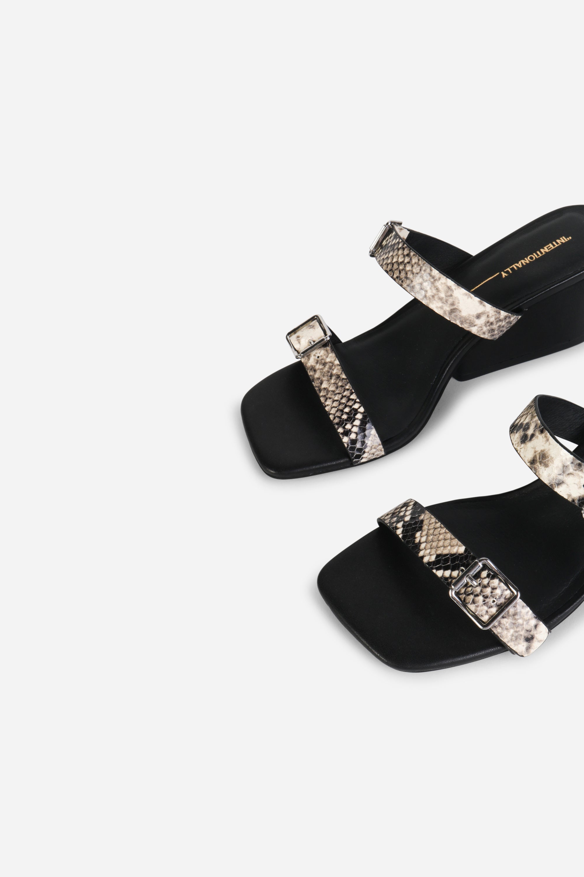 INTENTIONALLY __________. Surrender Snake Embossed Wedge Heel Sandal - Black/White