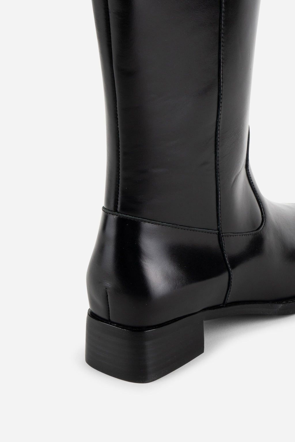 INTENTIONALLY __________. Tame Knee High Boot - Black
