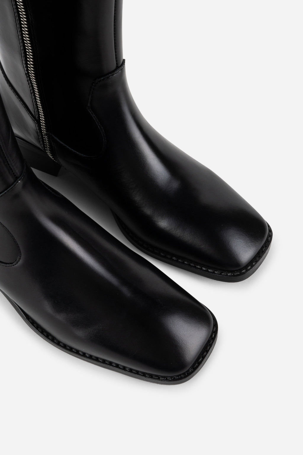 INTENTIONALLY __________. Tame Knee High Boot - Black