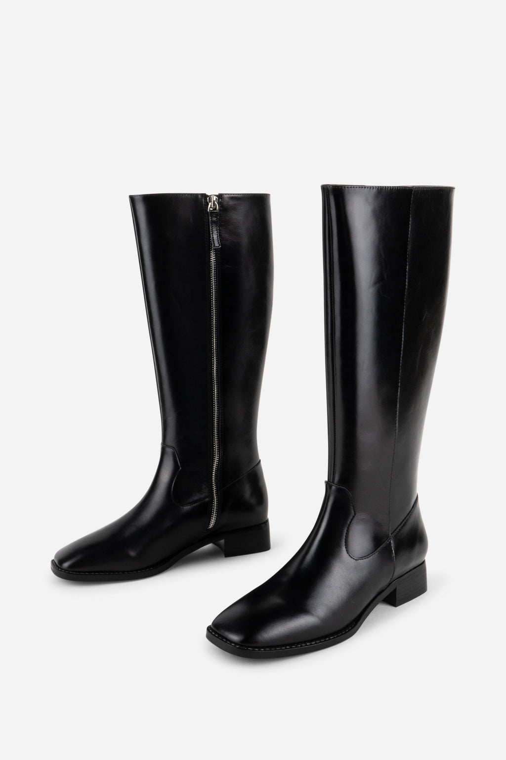 INTENTIONALLY __________. Tame Knee High Boot - Black