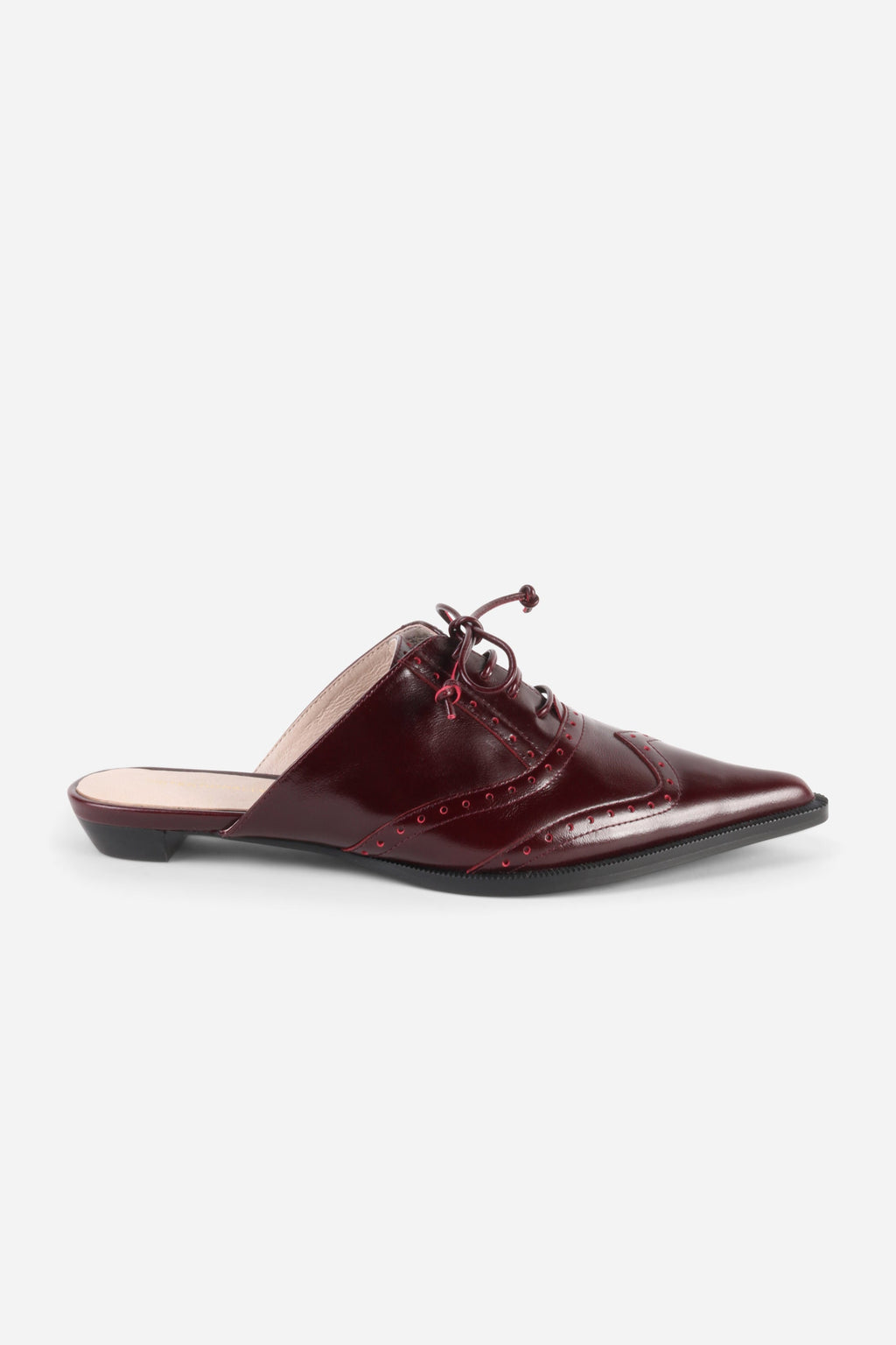 INTENTIONALLY __________. Tonian Lace-Up Flat Mule