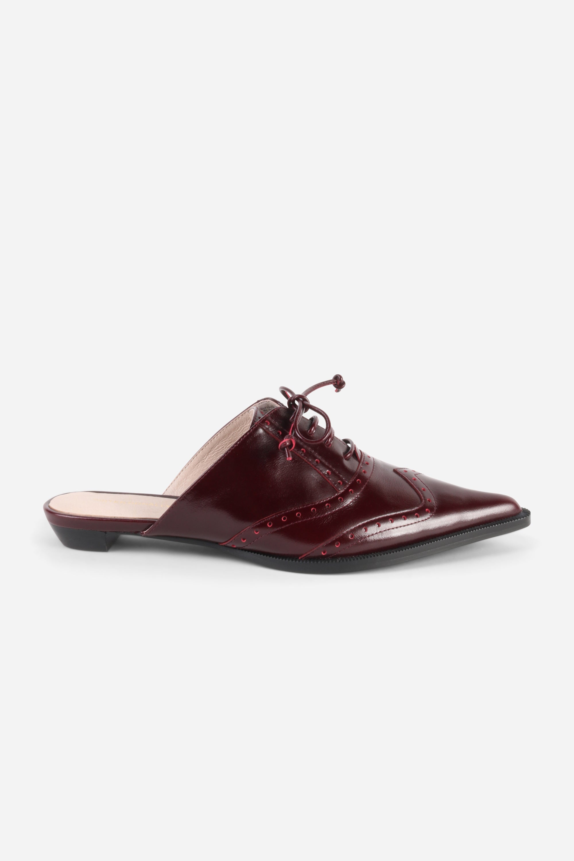INTENTIONALLY __________. Tonian Lace-Up Flat Mule