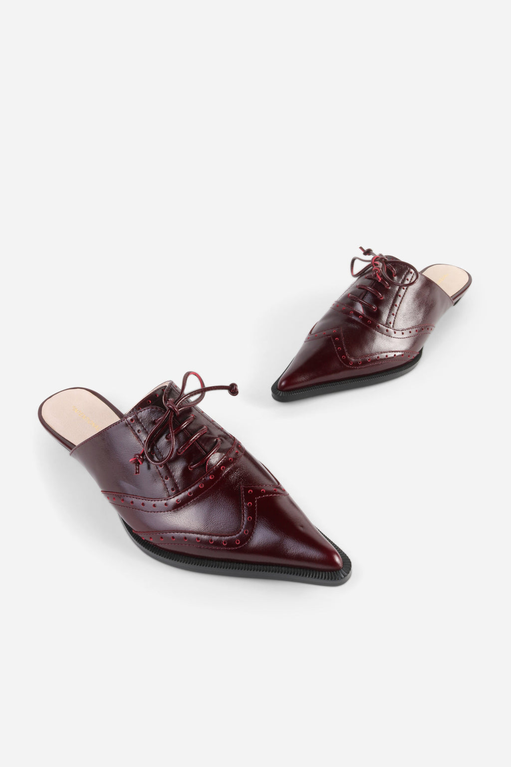 INTENTIONALLY __________. Tonian Lace-Up Flat Mule
