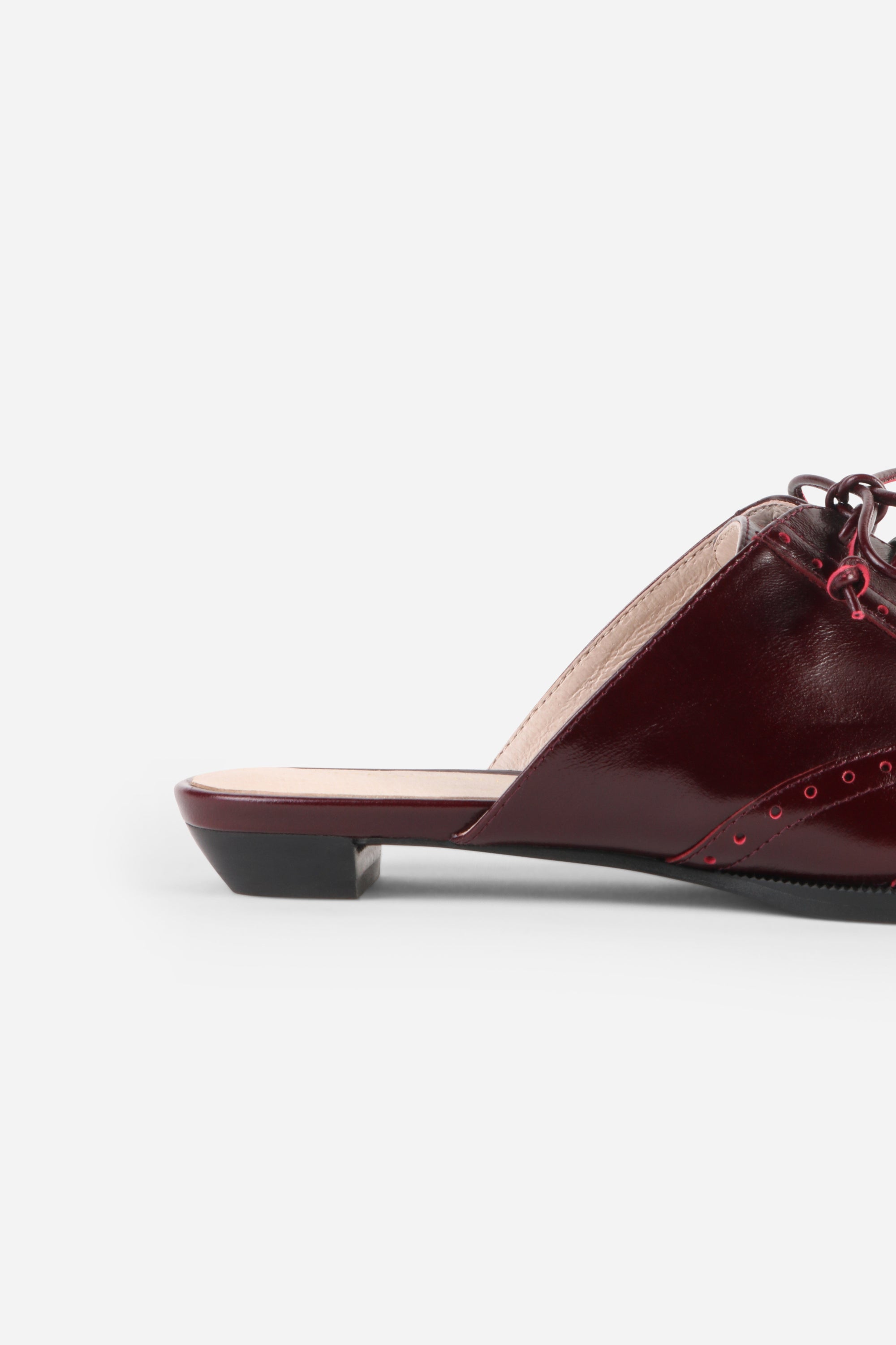 INTENTIONALLY __________. Tonian Lace-Up Flat Mule