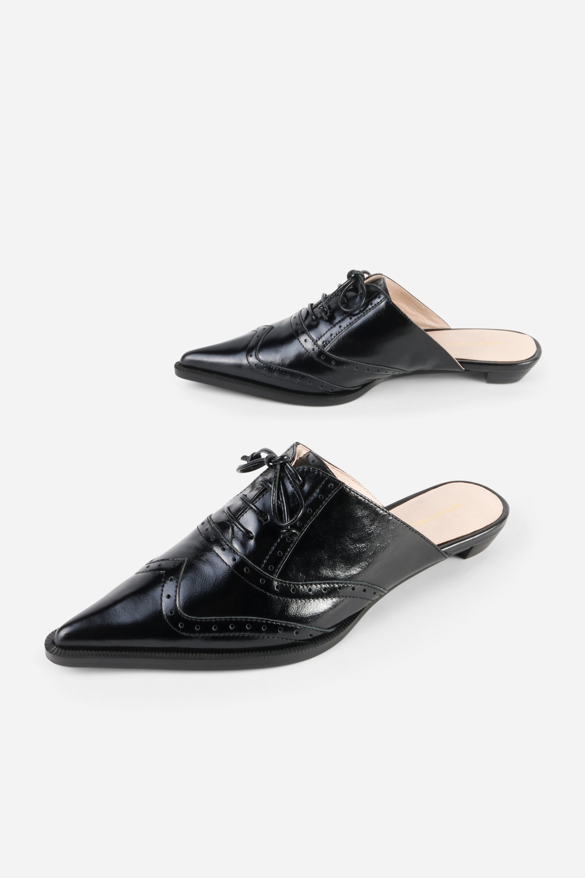 INTENTIONALLY __________. Tonian Lace-Up Flat Mule