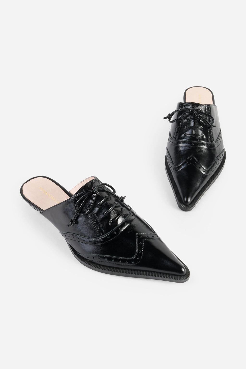 INTENTIONALLY __________. Tonian Lace-Up Flat Mule