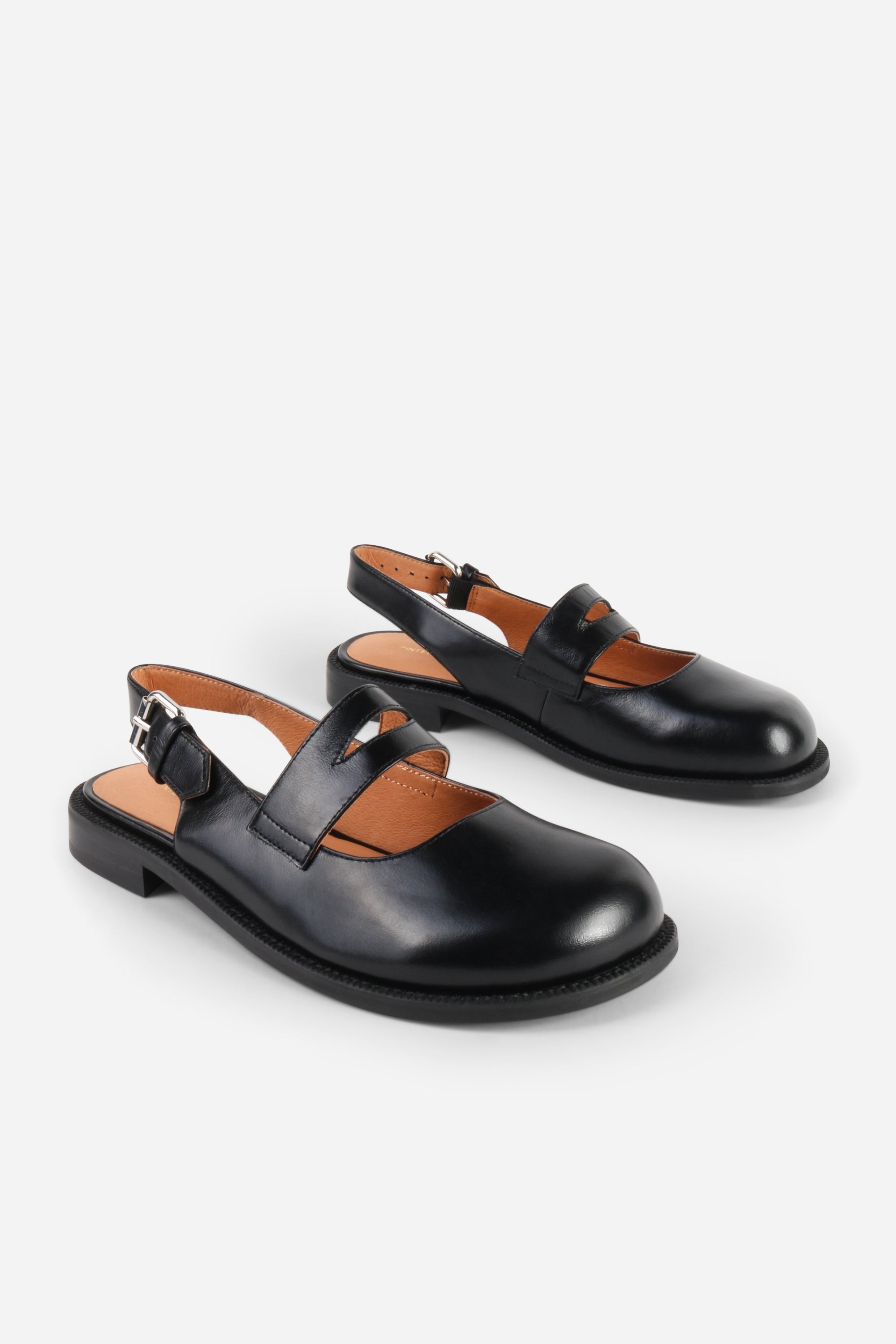 INTENTIONALLY __________. Vented Chunky Slingback Maryjane Shoes