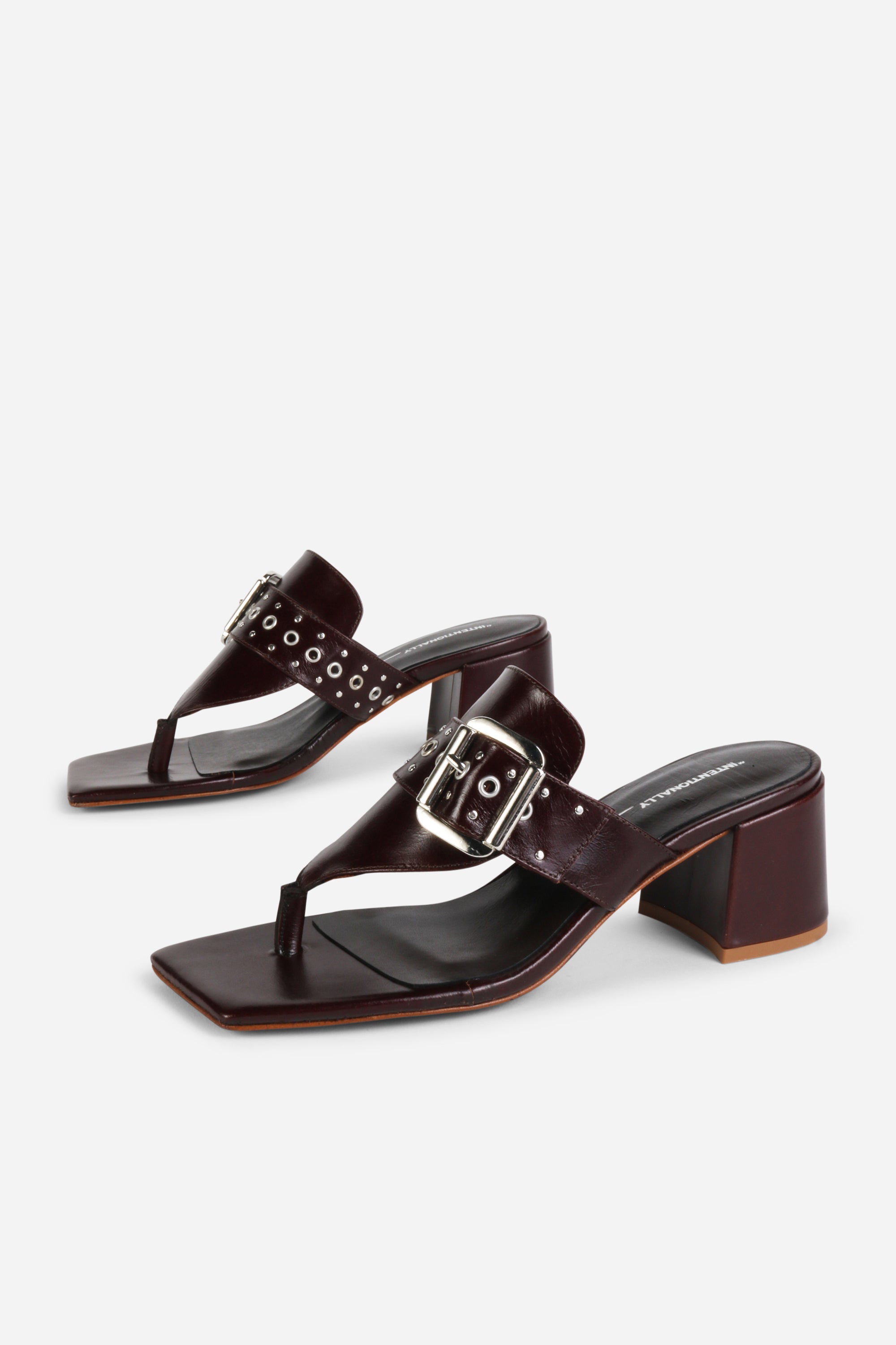 INTENTIONALLY __________. Wynona Thong Mule Heel