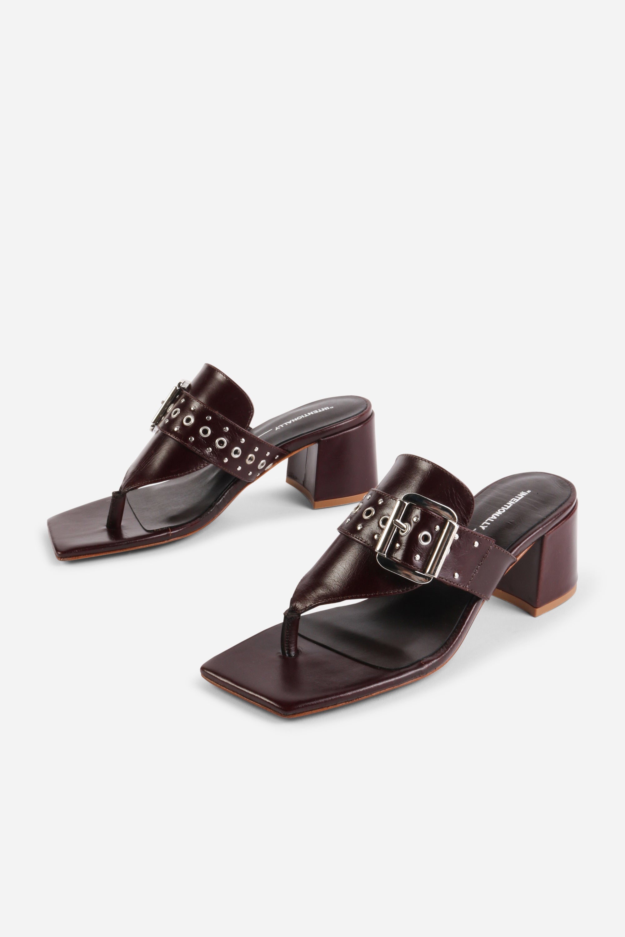 INTENTIONALLY __________. Wynona Thong Mule Heel