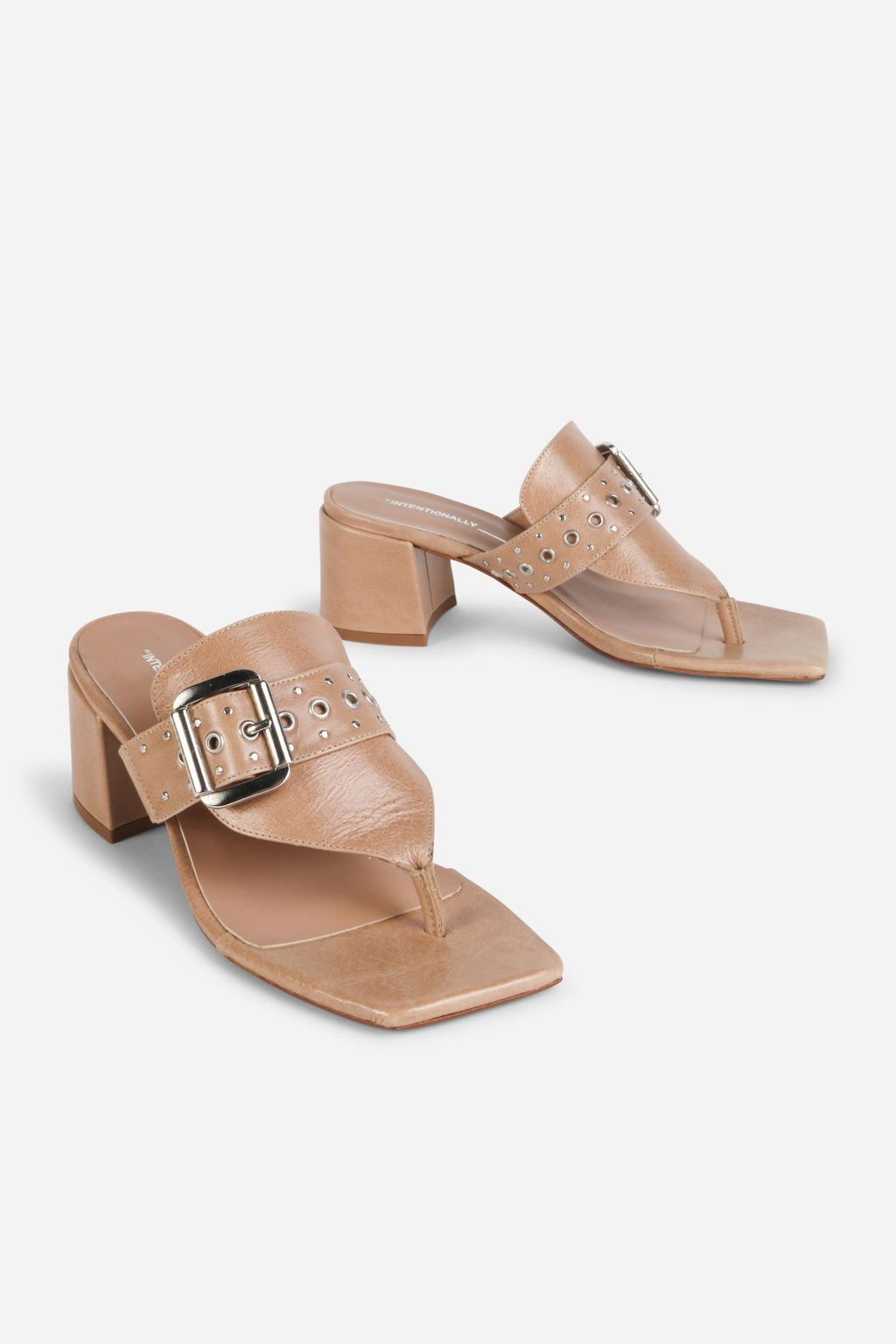 INTENTIONALLY __________. Wynona Thong Mule Heel