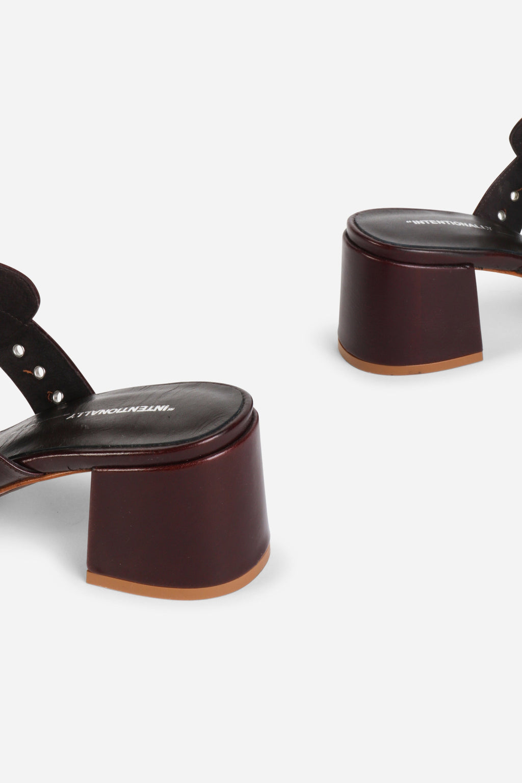 INTENTIONALLY __________. Wynona Thong Mule Heel