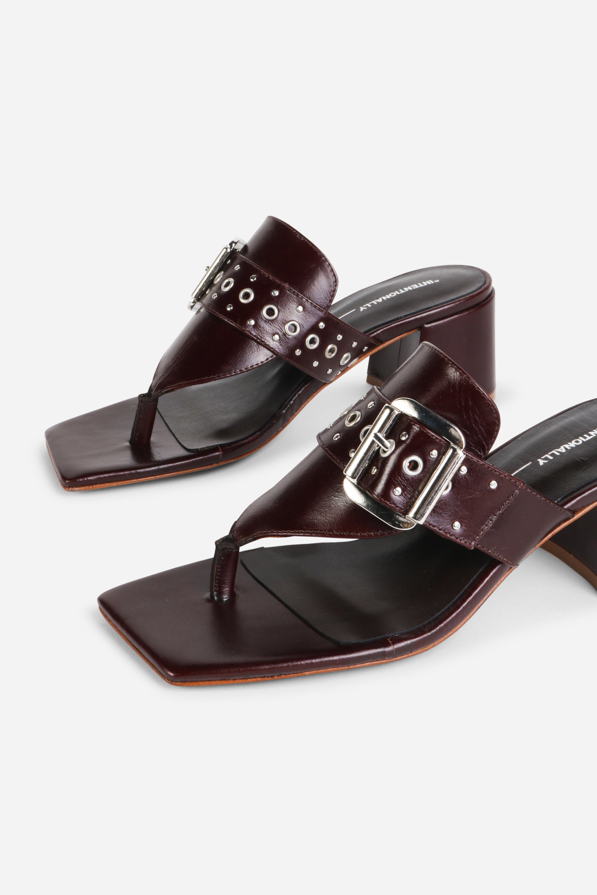 INTENTIONALLY __________. Wynona Thong Mule Heel