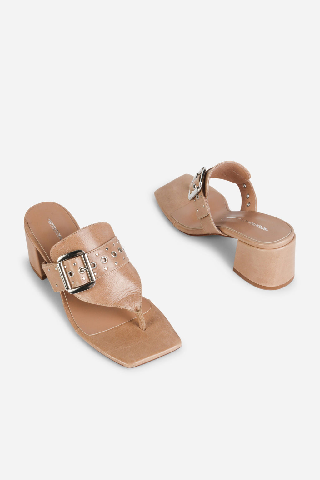 INTENTIONALLY __________. Wynona Thong Mule Heel