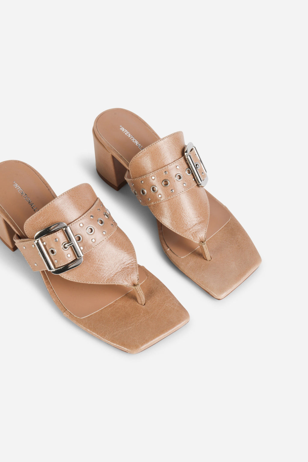 INTENTIONALLY __________. Wynona Thong Mule Heel