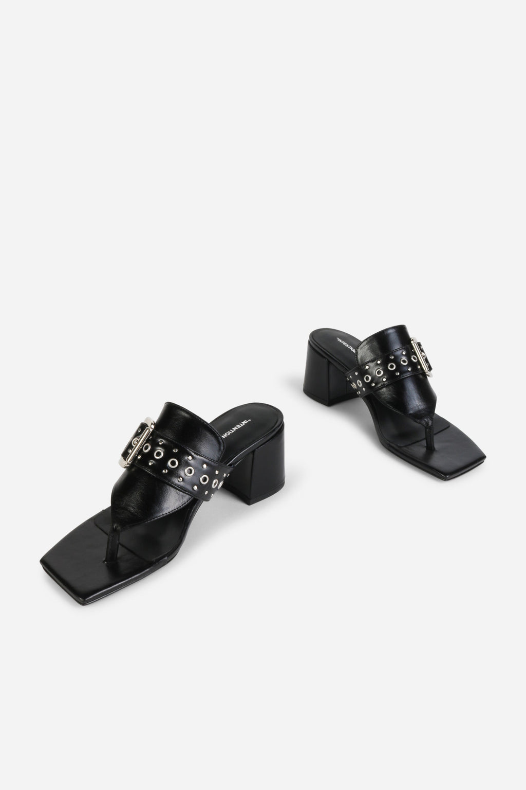 INTENTIONALLY __________. Wynona Thong Mule Heel