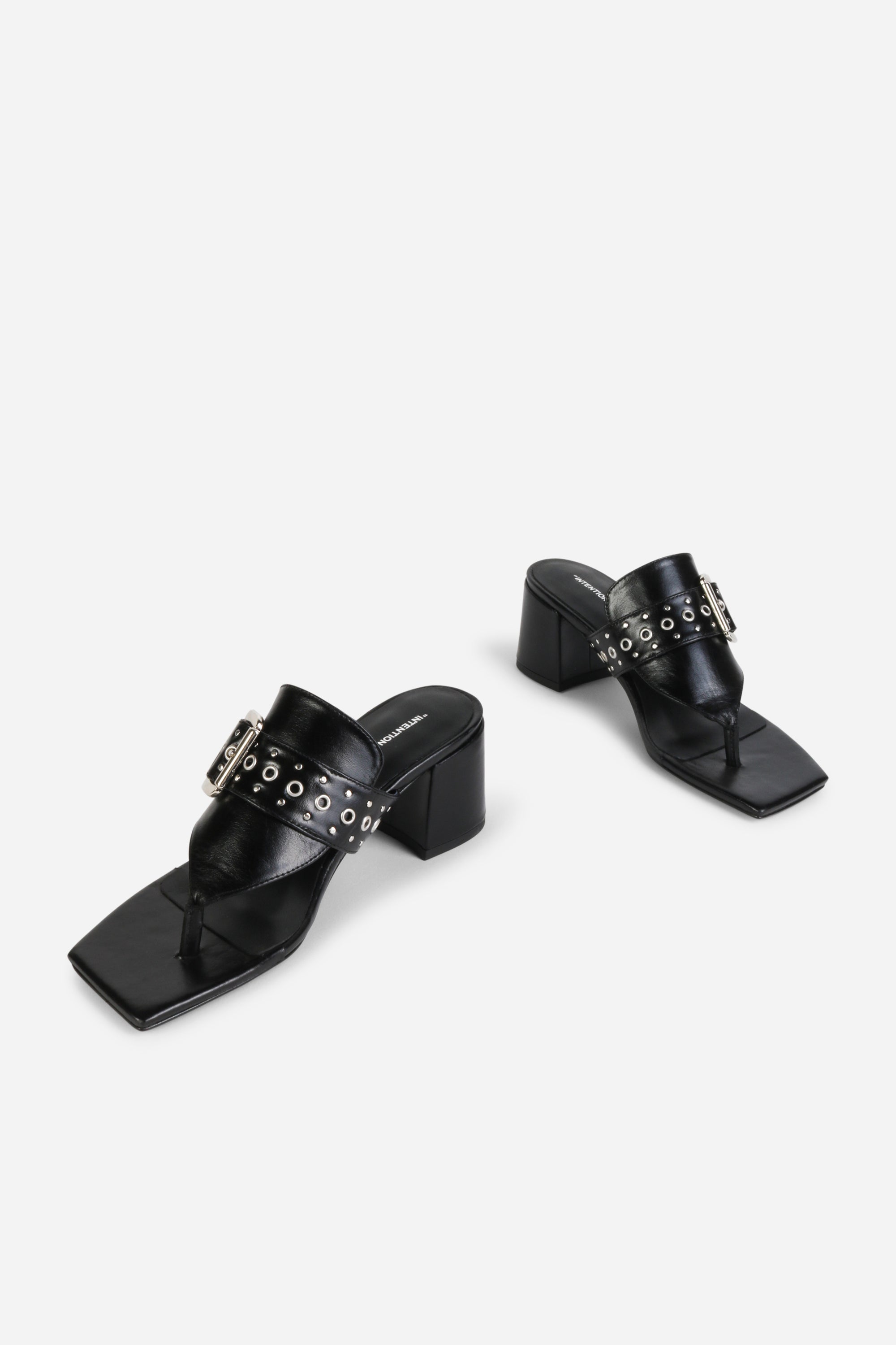 INTENTIONALLY __________. Wynona Thong Mule Heel