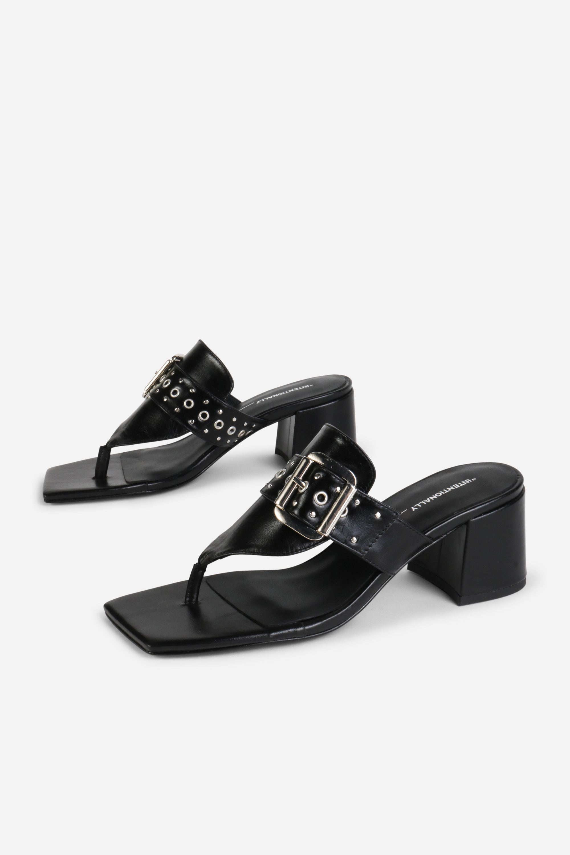 INTENTIONALLY __________. Wynona Thong Mule Heel