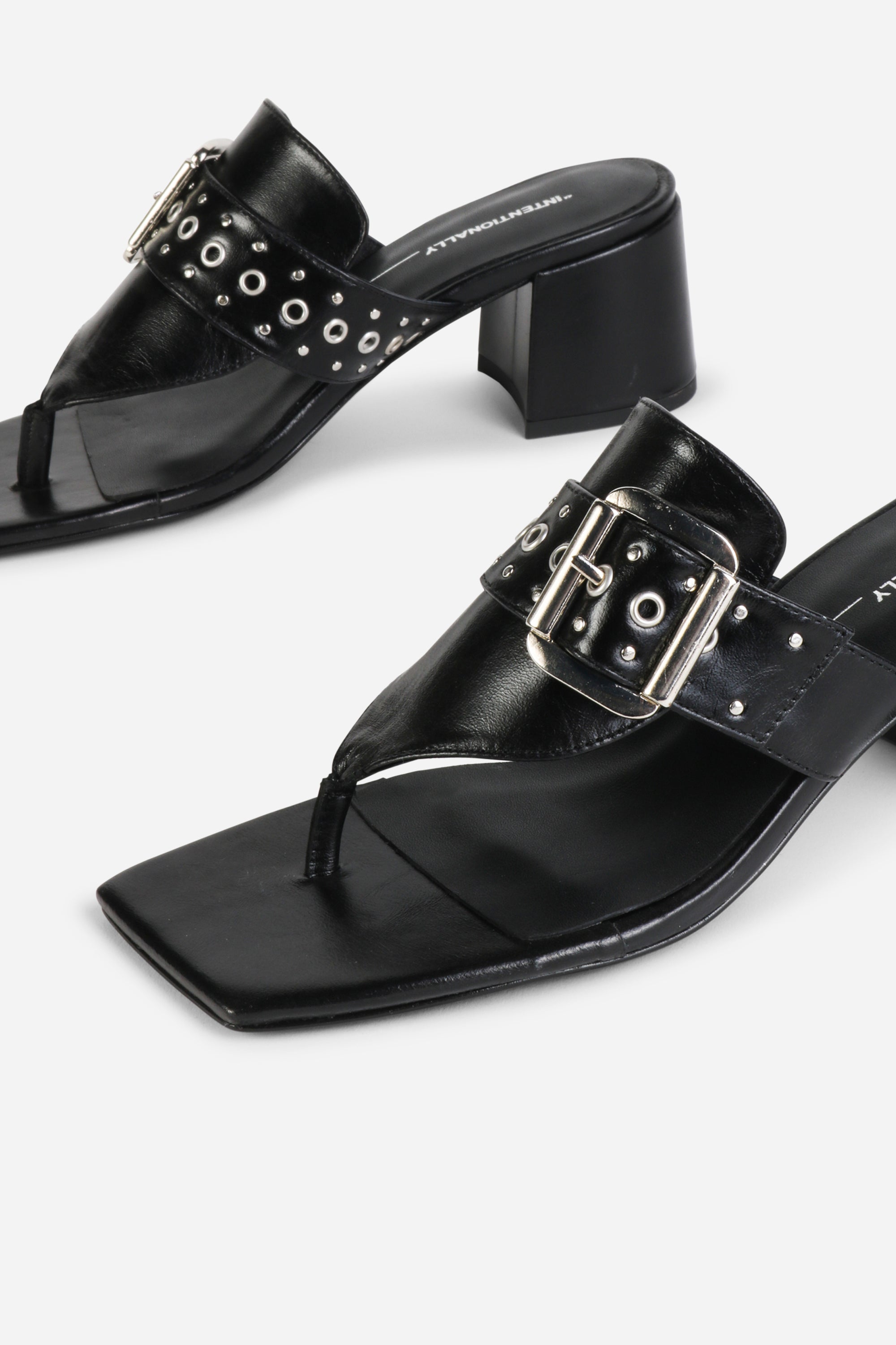 INTENTIONALLY __________. Wynona Thong Mule Heel