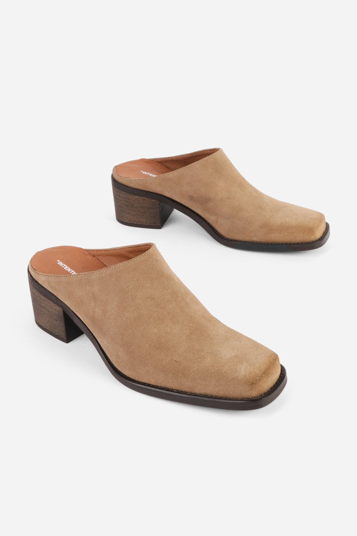 "INTENTIONALLY __________." Zelda Suede Heeled Mule