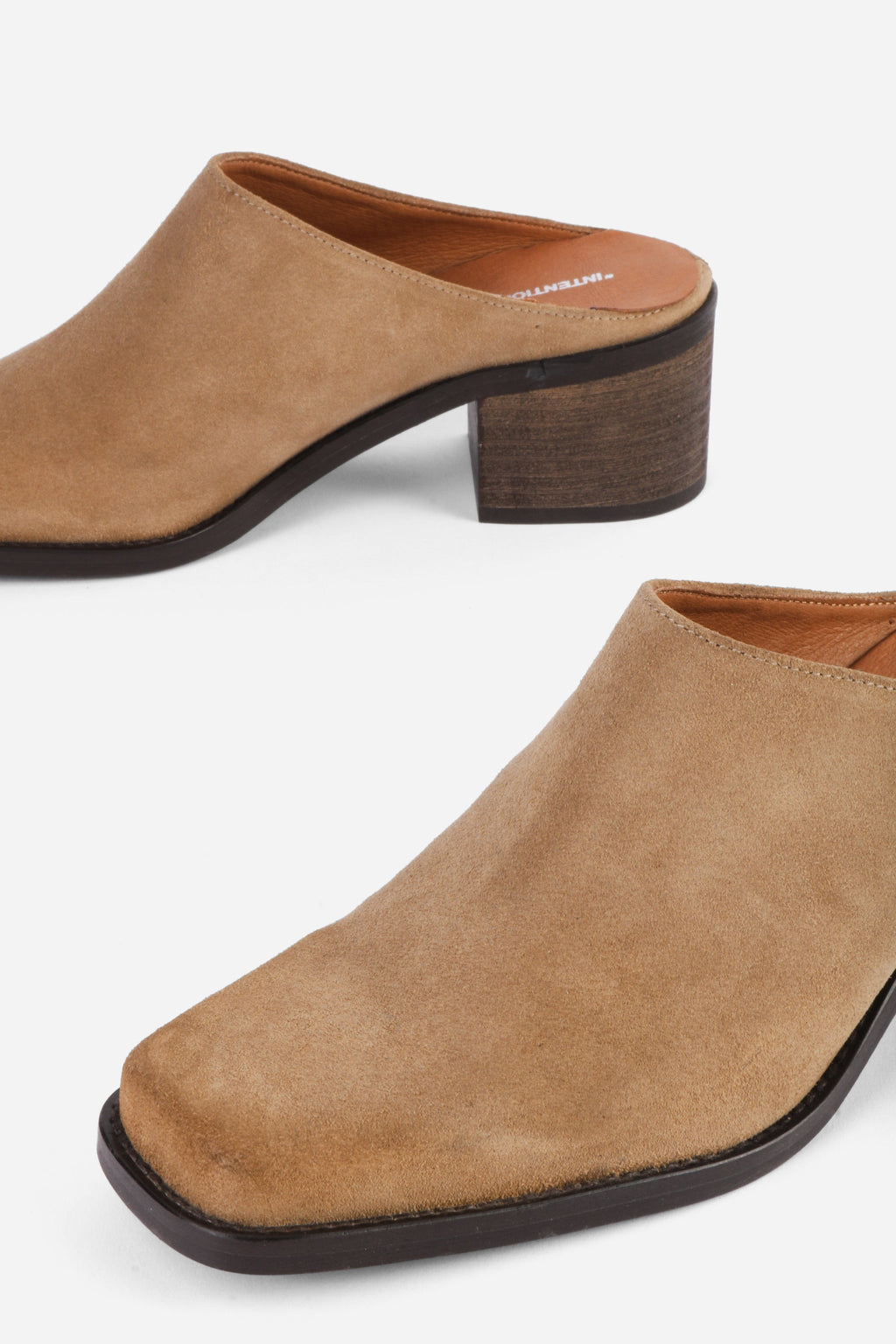 "INTENTIONALLY __________." Zelda Suede Heeled Mule